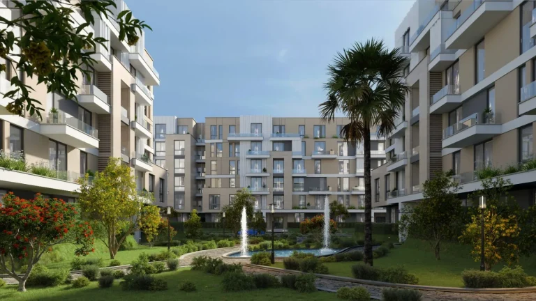 Comfort CIV WEST residential complex showcasing modern apartment buildings with spacious glass balconies, beautifully landscaped gardens, and a serene pond with elegant fountains, creating a perfect blend of comfort and sophistication